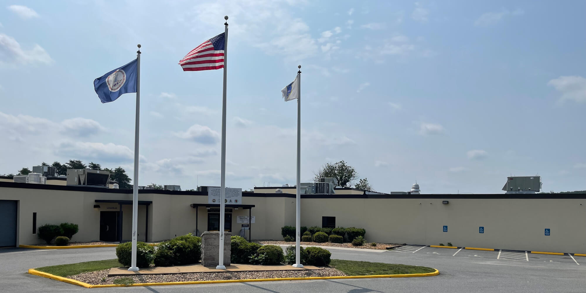 Flagpoles in front of main entrance to Central Virginia Regional Jail 